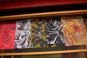 marbled papers in drying rack at Hajosy Arts studio