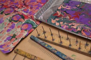 Marbled papers and marbling tools in Cristina Hajosy's Marbling workshops